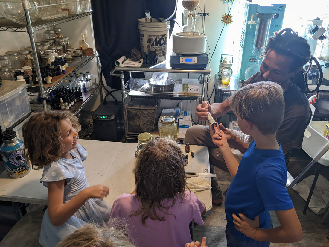 Ray Lovetree working alongside his daughters in the lab